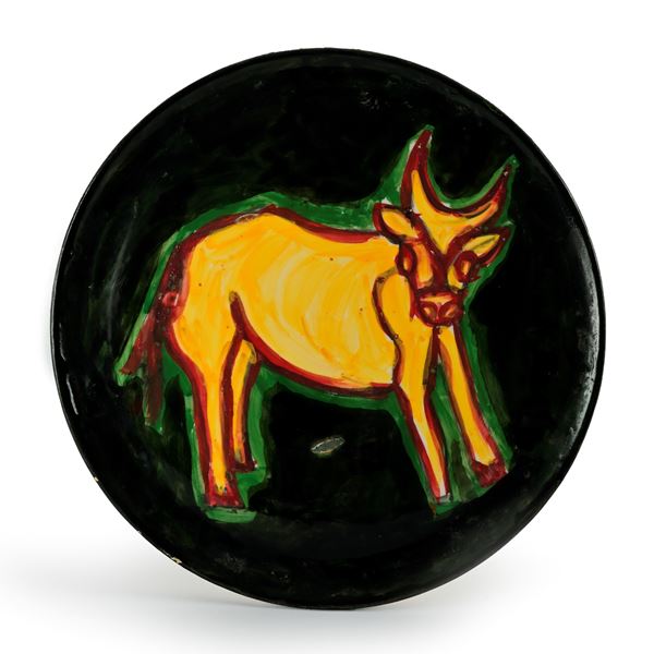 Placca di forma circolare in ceramica a coperta verde e policroma