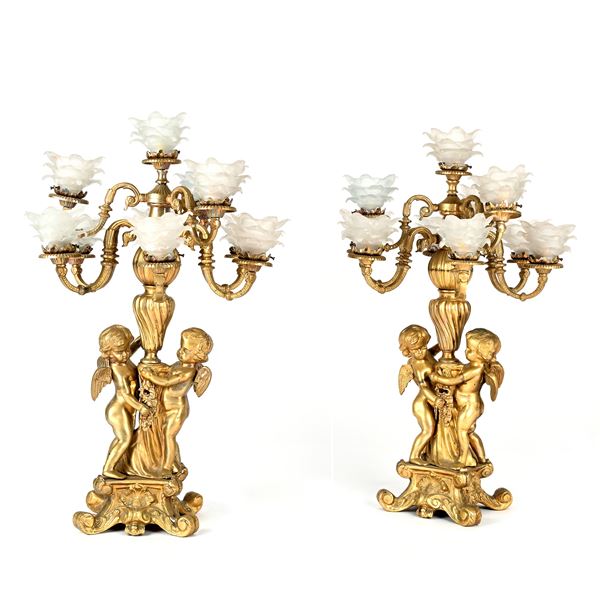 Coppia di candelabri in bronzo dorato a dieci luci ciascuno