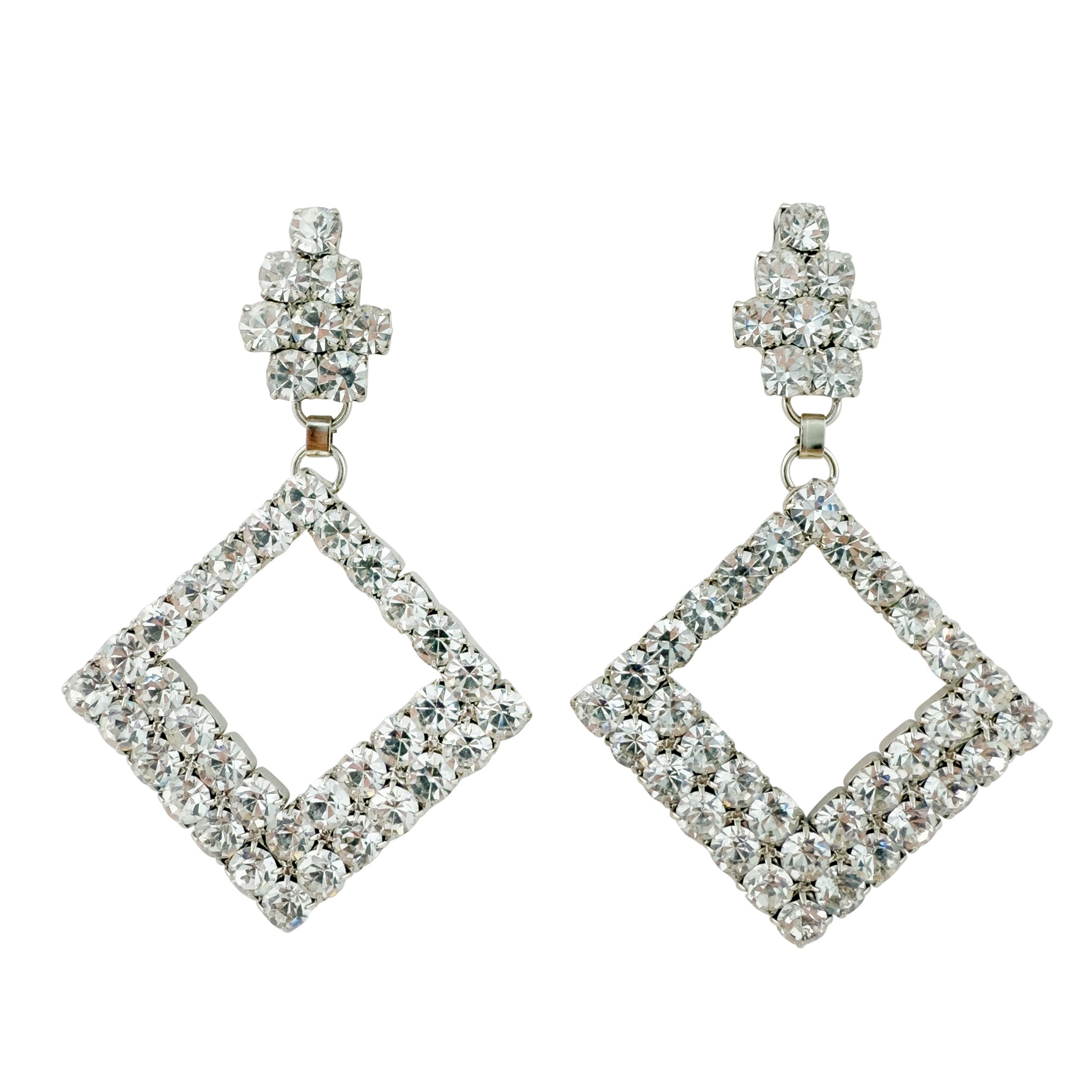 Quattro paia di orecchini argentati e strass di diversa forma