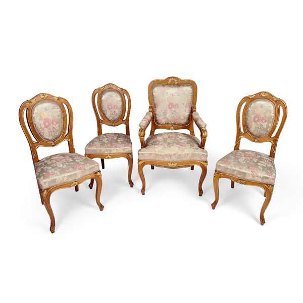 Poltrona e tre sedie in legno parzialmente dorato