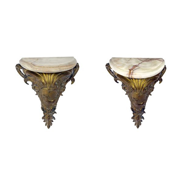 Coppia di mensoline in bronzo dorato