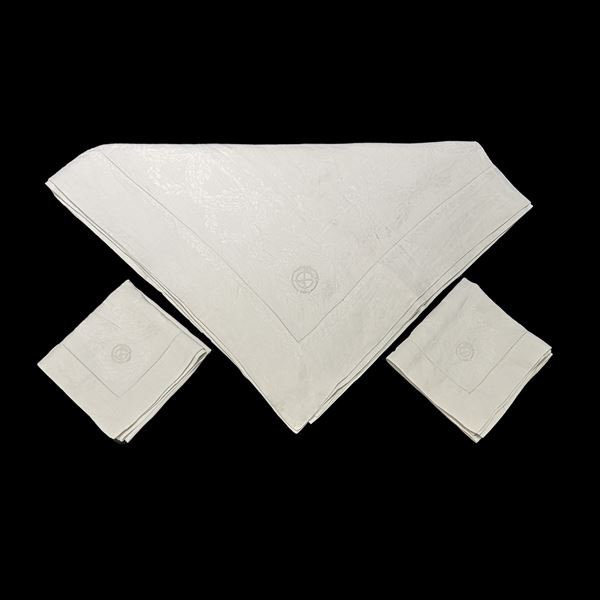 Tovaglia e 8 tovaglioli in lino di Fiandra ricamato a festoni e monogramma GM