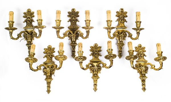 Sei appliques in bronzo cesellato e dorato