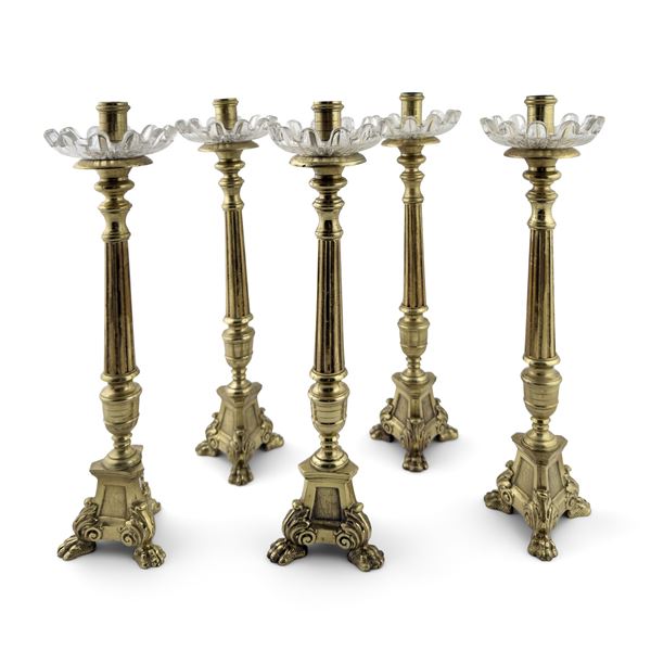 Cinque candelieri in bronzo e metallo dorato, XIX secolo