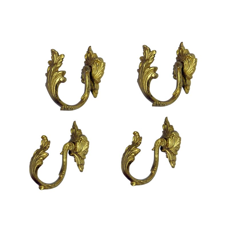 Porte embrasse in bronzo dorato, cesellate a voluta fogliata