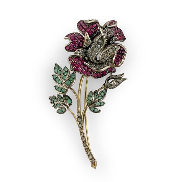 Spilla in argento e oro giallo 18kt. cesellata a tralcio di rosa
