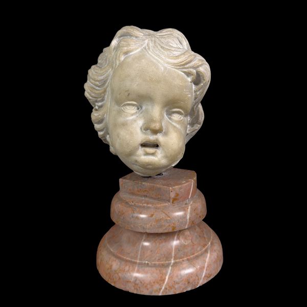 Testa di putto in marmo bianco, Roma, XVII secolo