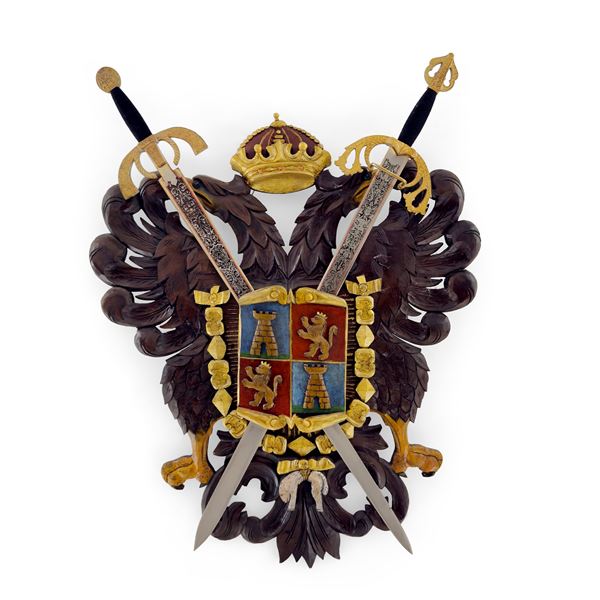 Stemma in legno intagliato e dorato a raffigurare un'aquila bicipite