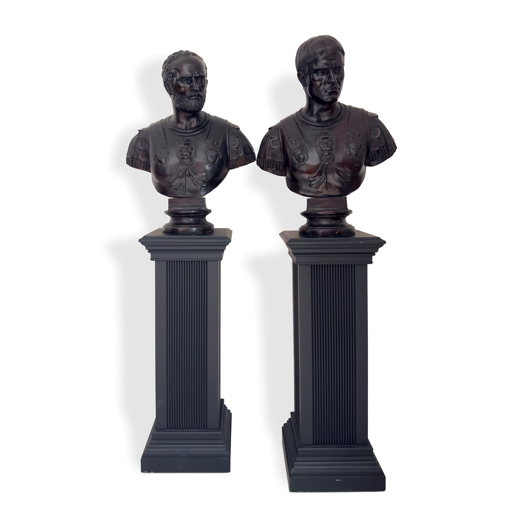 Quattro busti in bronzo di imperatori romani, con base in legno ebanizzato