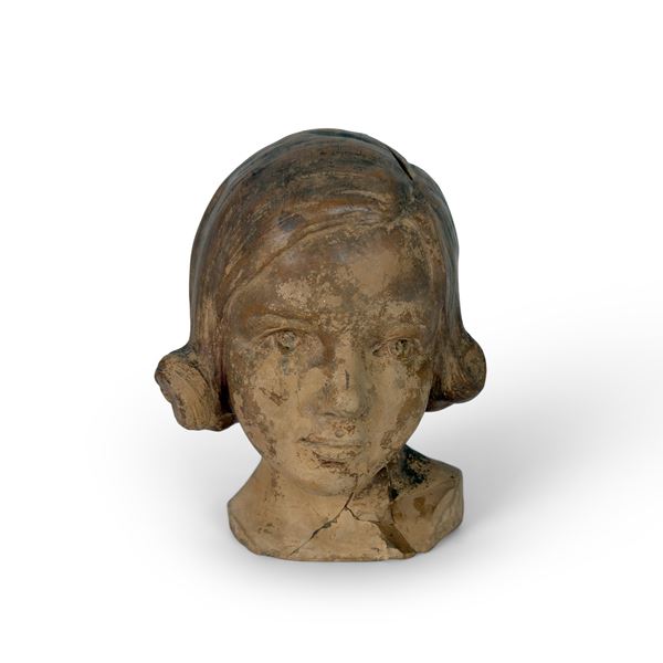 Testa di bimba in terracotta