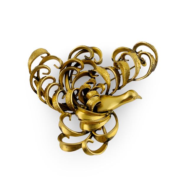 Spilla in metallo dorato