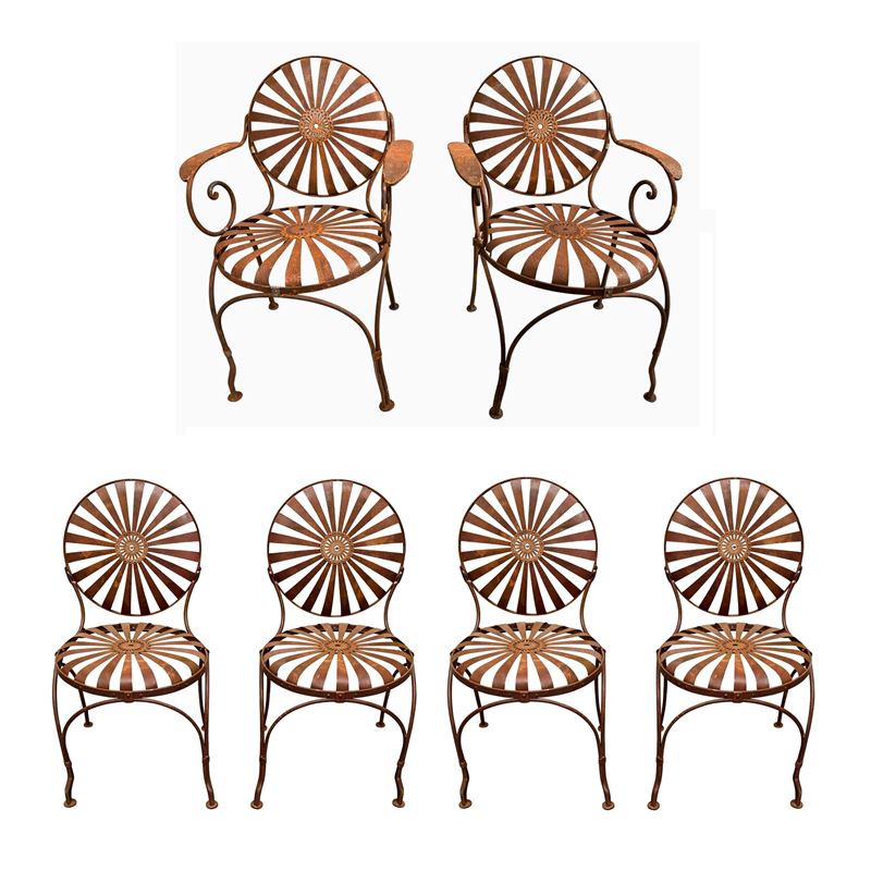 Coppia di poltrone e quattro sedie in ferro battuto