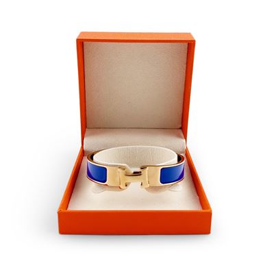 Hermès, Bracciale Clic H in metallo dorato e smalto blu