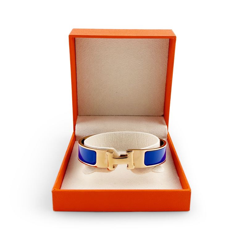 Hermès, Bracciale Clic H in metallo dorato e smalto blu