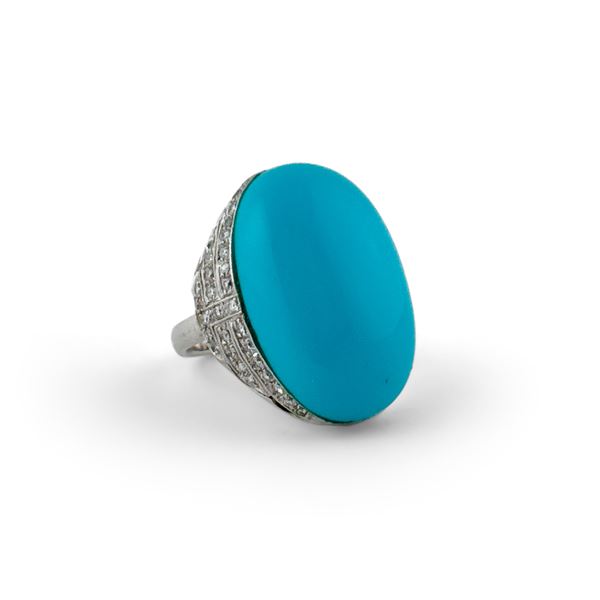 Anello in oro bianco 18kt. con grande turchese cabochon e brillanti a contorno