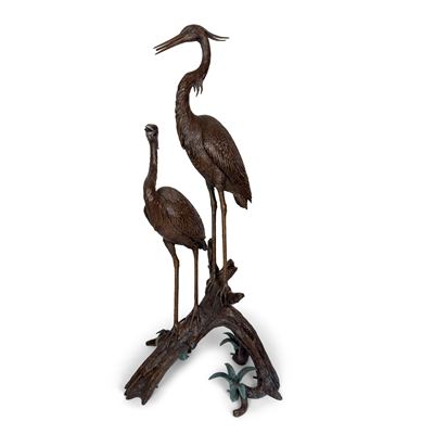 Fontana in bronzo patinato, con due trampolieri su tronco fogliato