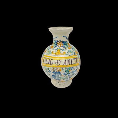 Deruta, Vaso da farmacia in maiolica bianca e policroma con iscrizione “OLIO D’ANETO”, 1673