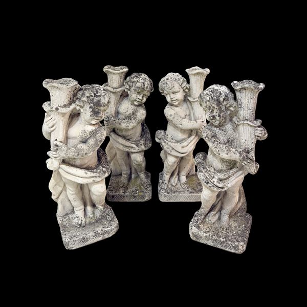 Quattro sculture in pietra composta